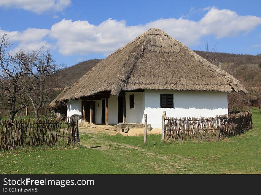 Rural thatched roof house in the hills.