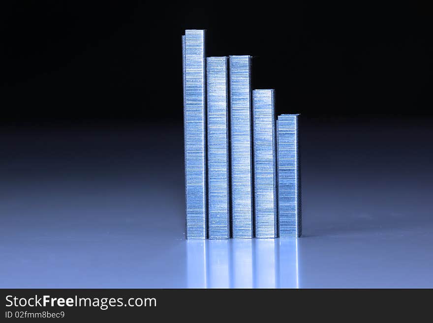 Staple strips arranged in the form of graph. Staple strips arranged in the form of graph