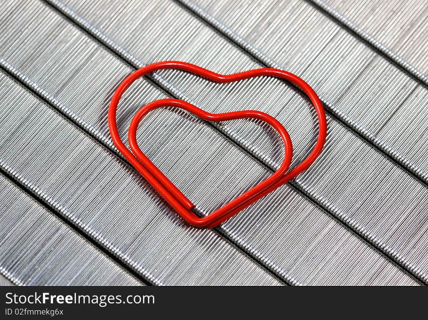 Red  paper clip in heart shape