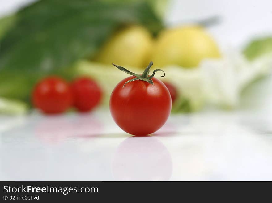 Crimson tomatoes on white background image