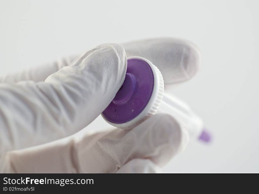 A capillary needle for blood samples in the finger. The purple colour means it is a size for adults.