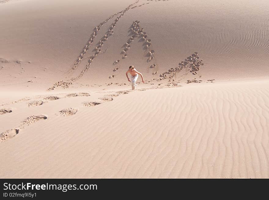 Playing in a sand dune