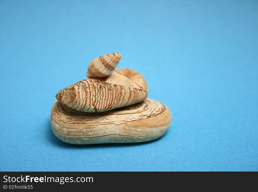 Spa Zen Stones stack on a blue background.