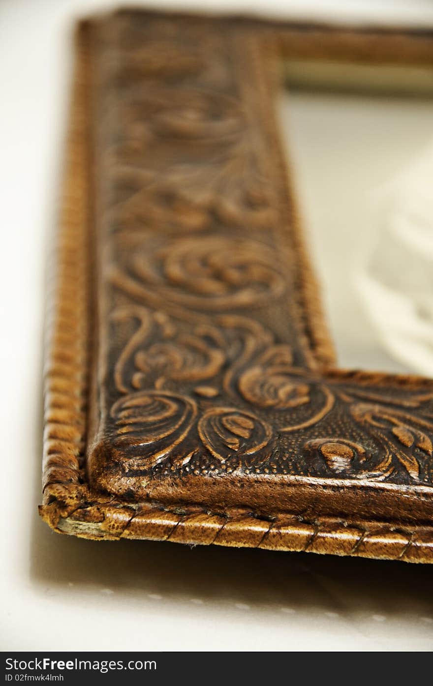 A detail of an old frame, leather, for picture. A detail of an old frame, leather, for picture