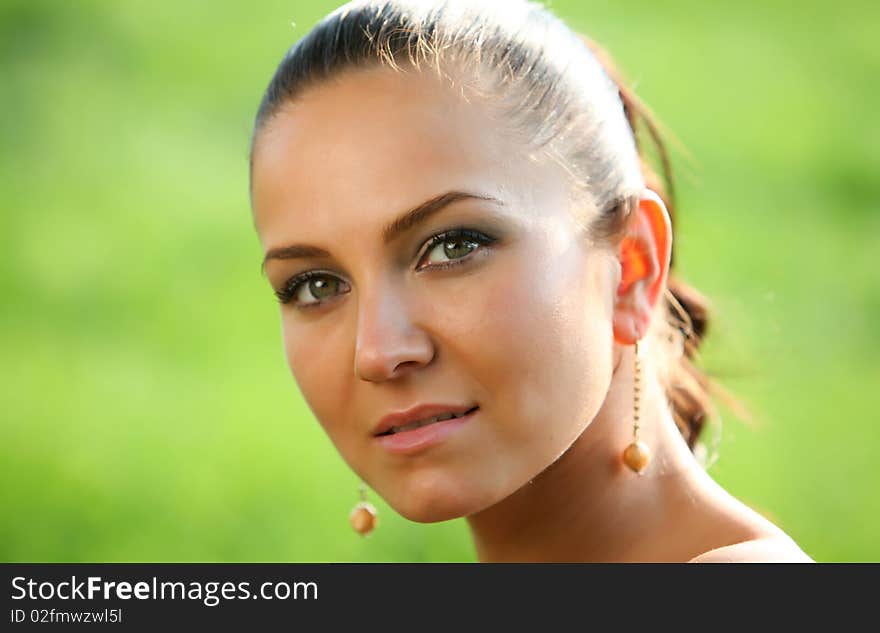 Cute brown haired portrait photo of a ncie young caucasian girl with some water mirroring reflection. Perfect skin and nice green eyes. Cute brown haired portrait photo of a ncie young caucasian girl with some water mirroring reflection. Perfect skin and nice green eyes.