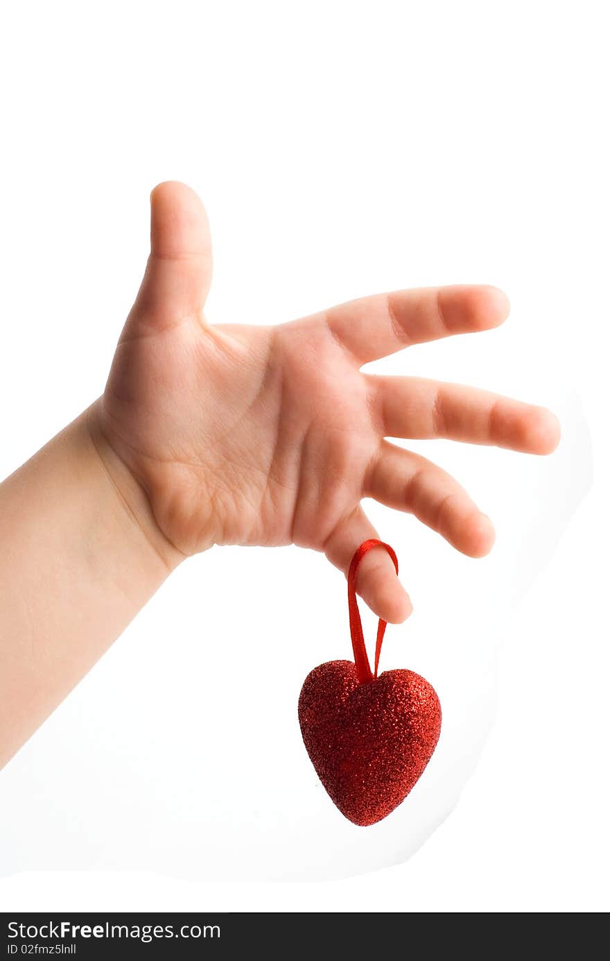 Red heart in the children's arm, white background