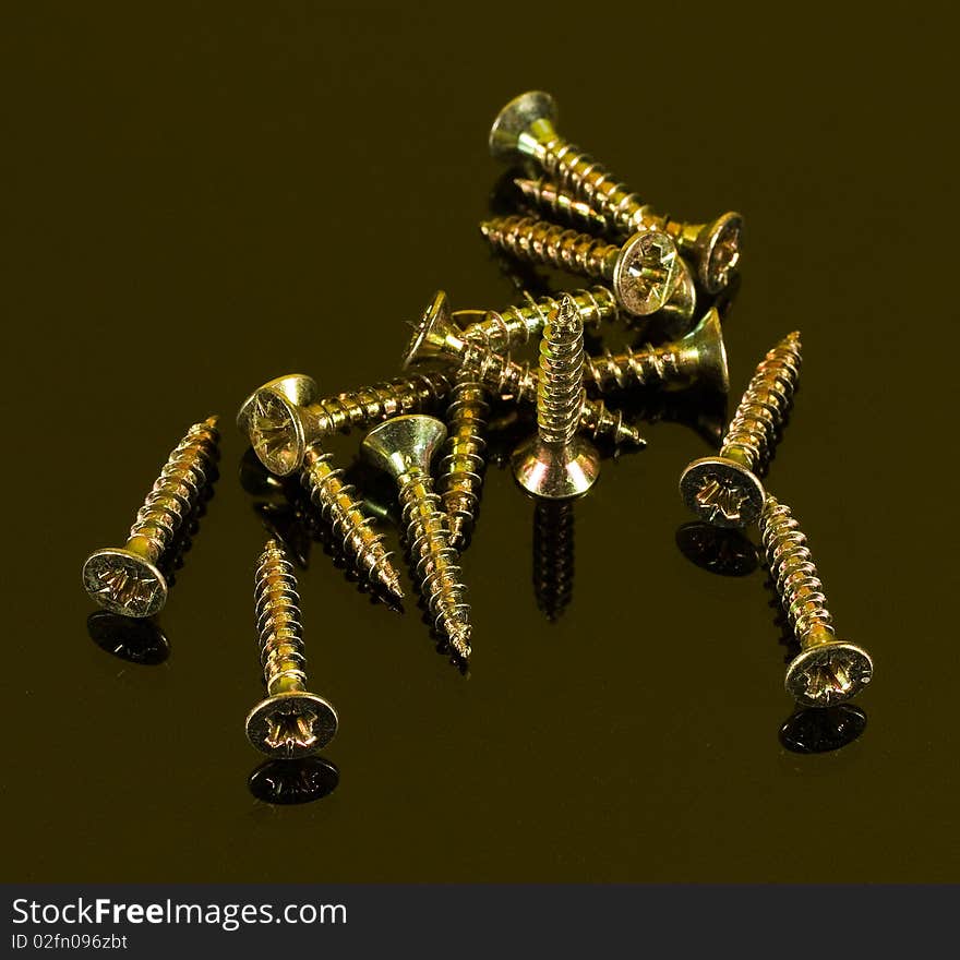 nail. Macro shooting screws on a brown background. nail. Macro shooting screws on a brown background.