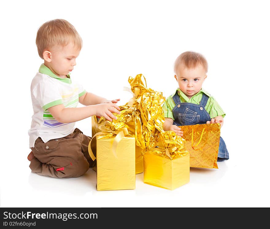 Two boys with gifts. Isolated on white background