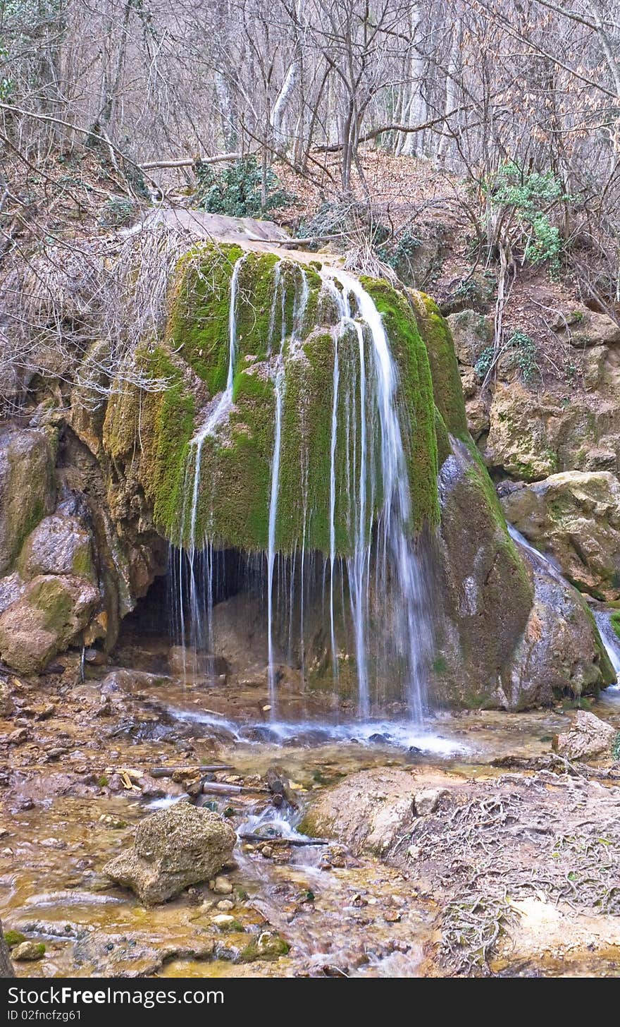 Full-flowing waterfall in forest