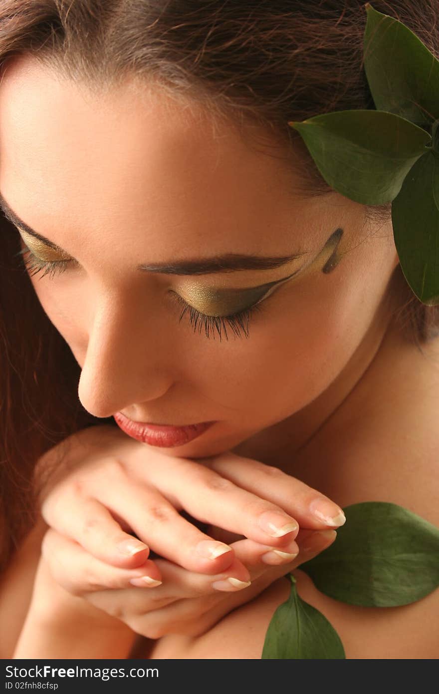 Beautiful young woman with green leaves. Beautiful young woman with green leaves