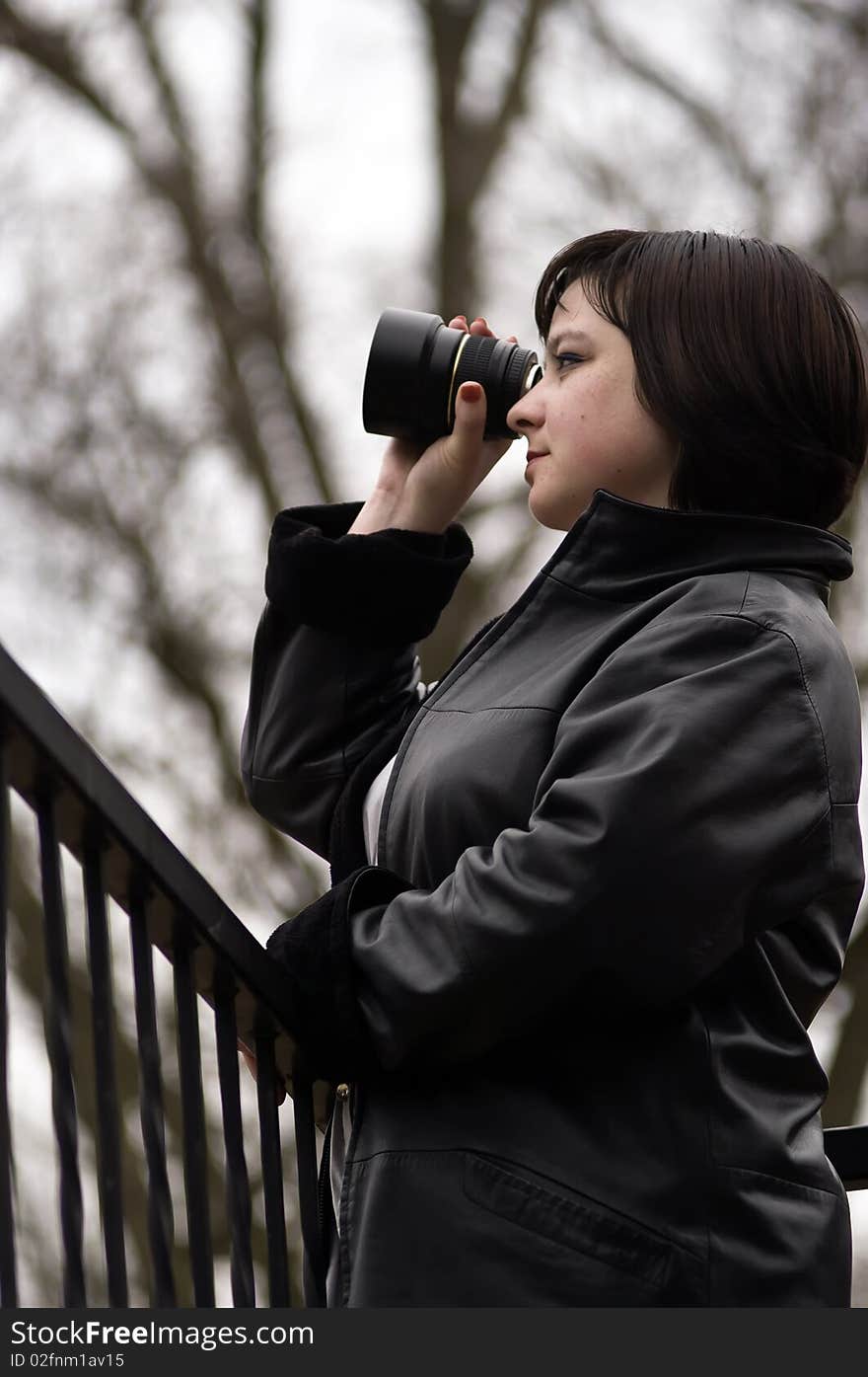 The young woman with the lens. The young woman with the lens