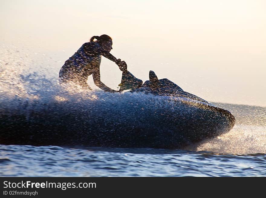 Beautiful girl riding her jet skis