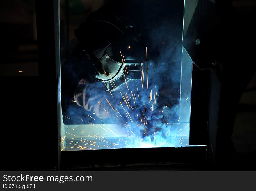 Man in action, worker weld metal. Man in action, worker weld metal