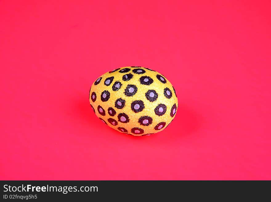 Painted egg on pink background