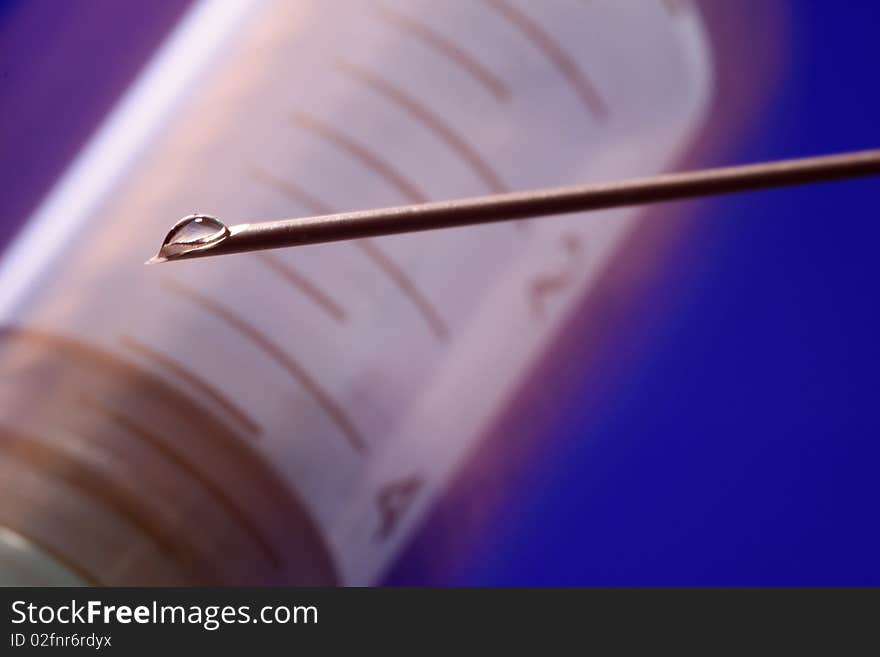 Needle syringe with drop of liquid. Needle syringe with drop of liquid