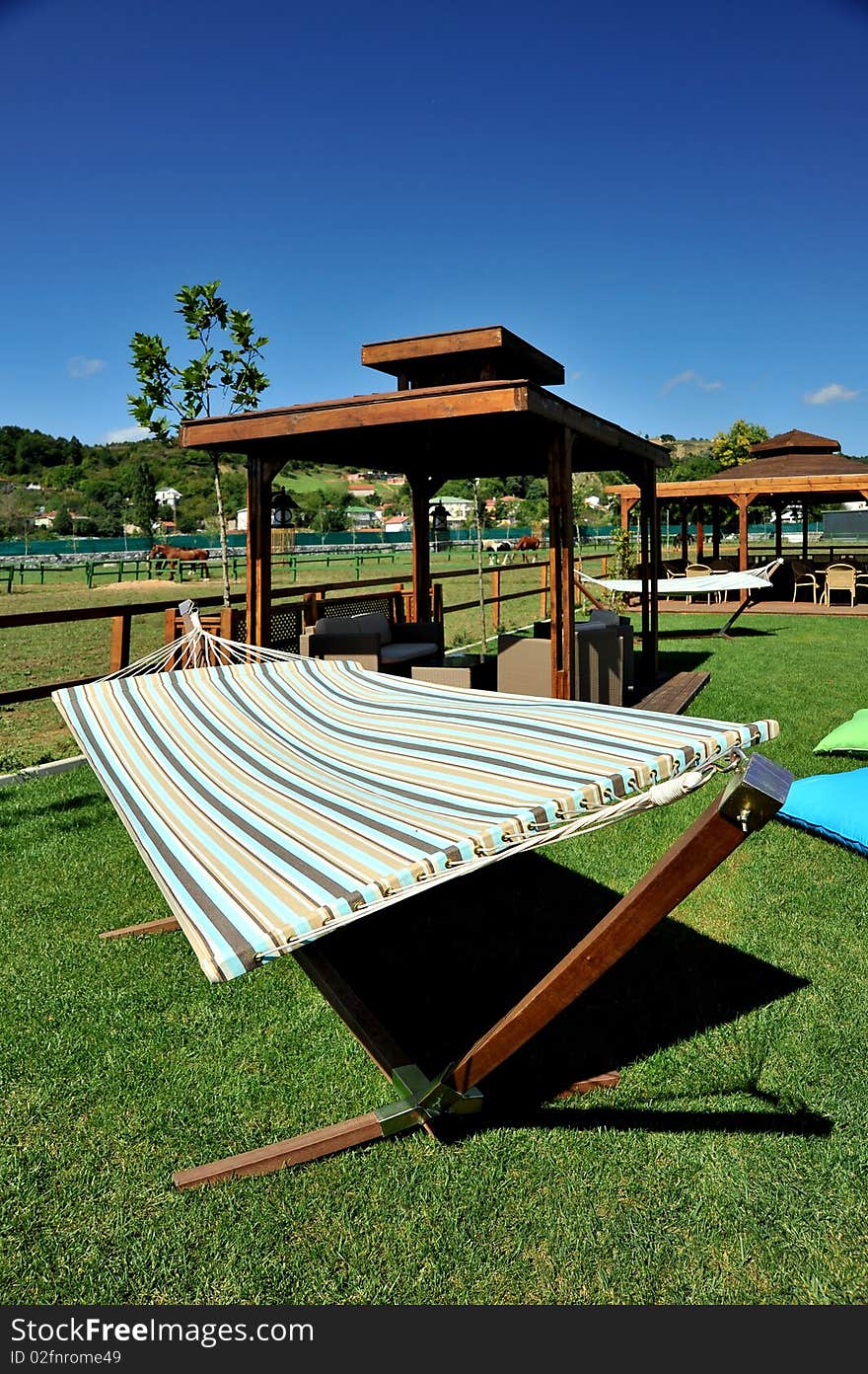 Hammock at garden with wide blue sky. Hammock at garden with wide blue sky