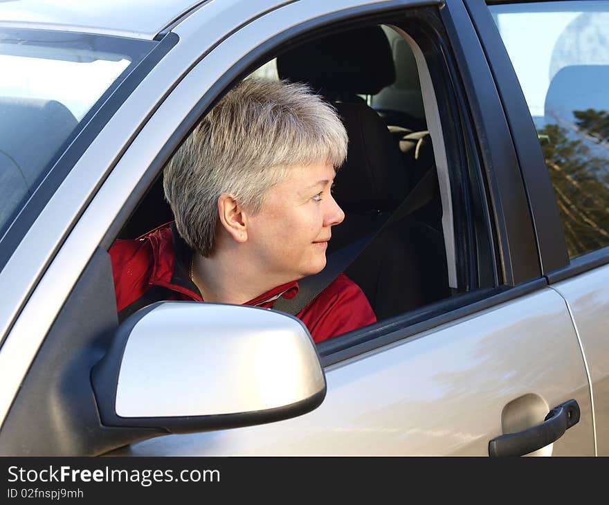 Middelage woman drivng in her car. Middelage woman drivng in her car