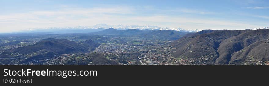 Panorama taken between the Lake of Como and the alps at the base of the alps. Panorama taken between the Lake of Como and the alps at the base of the alps