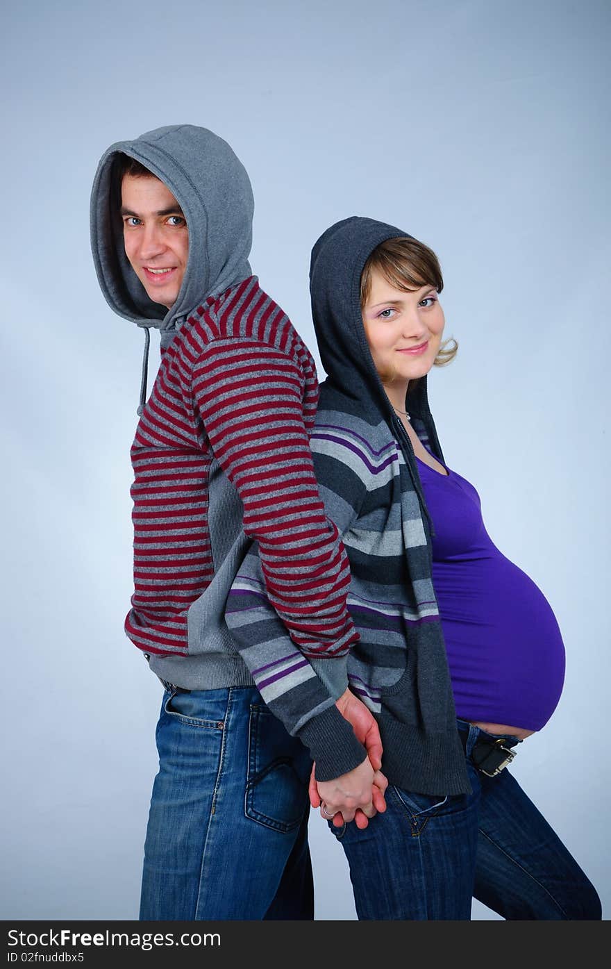 Happy young couple in anticipation of the twins in studio. Happy young couple in anticipation of the twins in studio