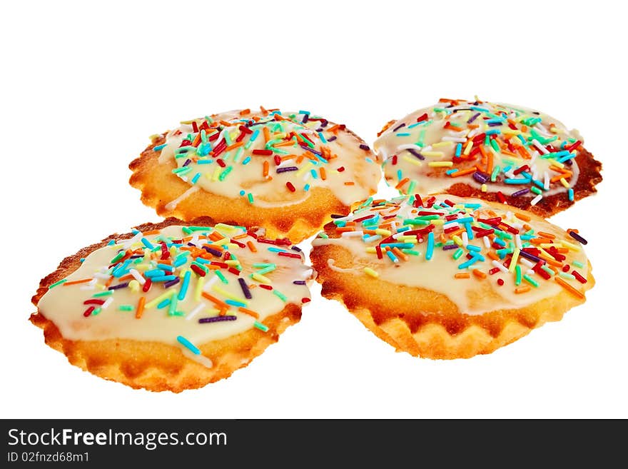 Four cakes with colorful decoration isolated over white background. Four cakes with colorful decoration isolated over white background.