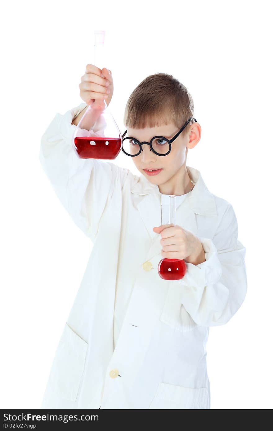 Shot of a little boy in a doctors uniform. Isolated over white background. Shot of a little boy in a doctors uniform. Isolated over white background.