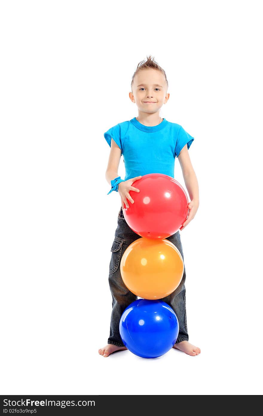 Portrait of a cute sporty boy standing with balls. Isolated over white background. Portrait of a cute sporty boy standing with balls. Isolated over white background.