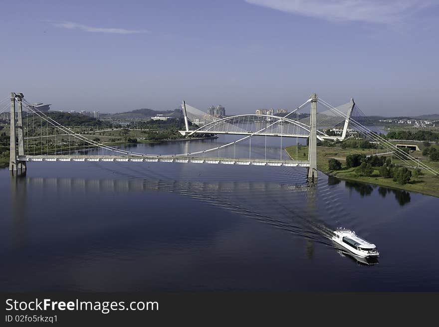 Scenic view of lake cruise by boat at two bridges in Putrajaya, Malaysia