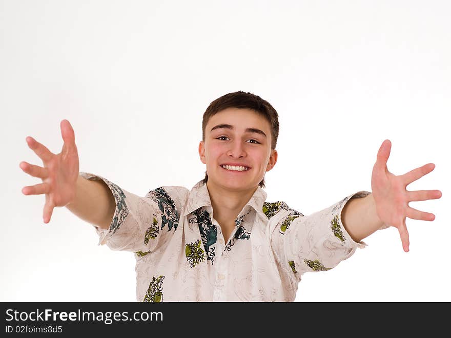 Handsome young man standing on a white