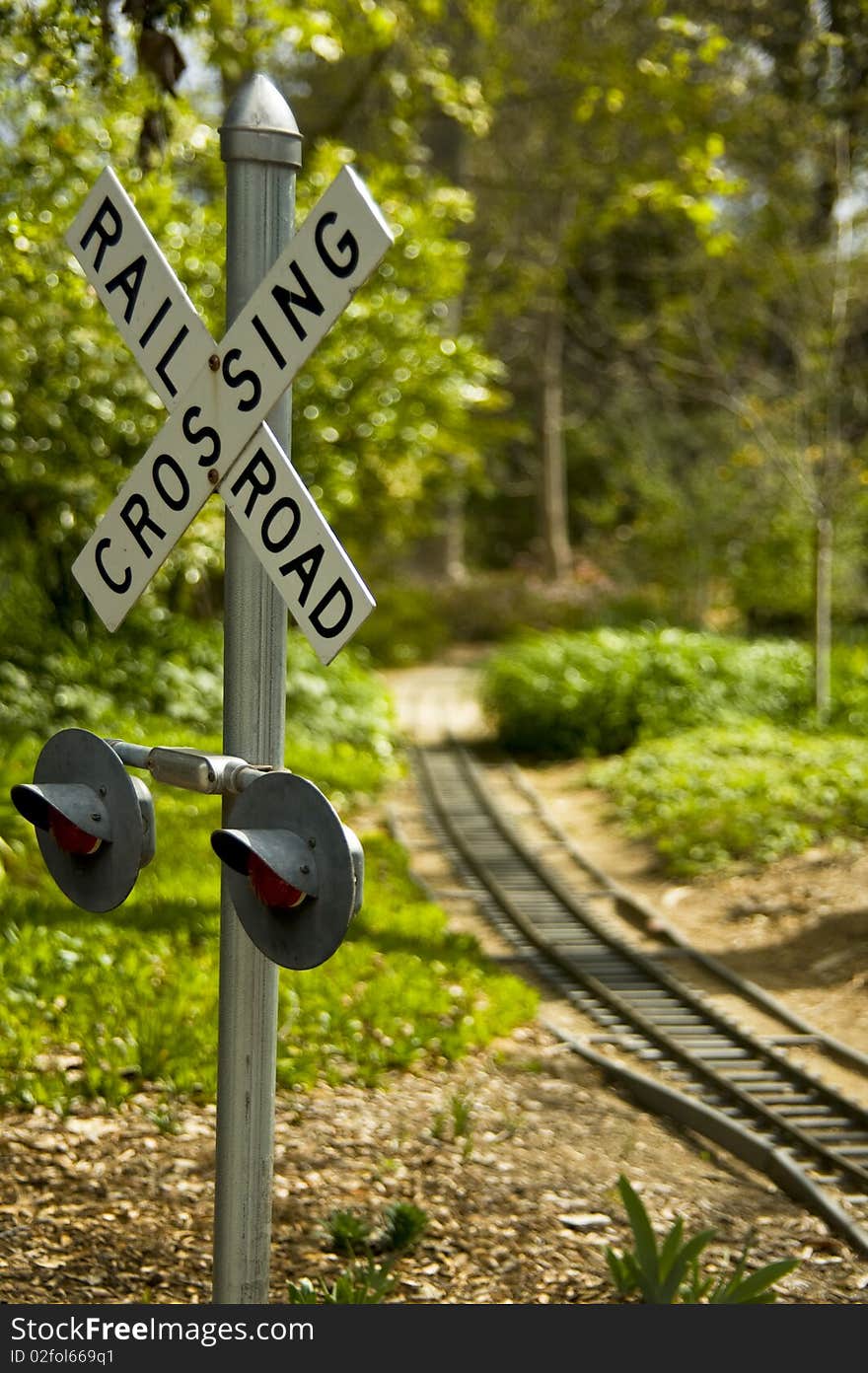 Railroad crossing sign with tracks