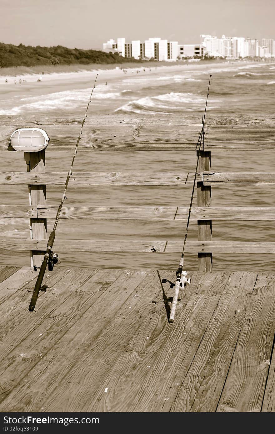 Two fishing poles waiting to catch the big one. Two fishing poles waiting to catch the big one