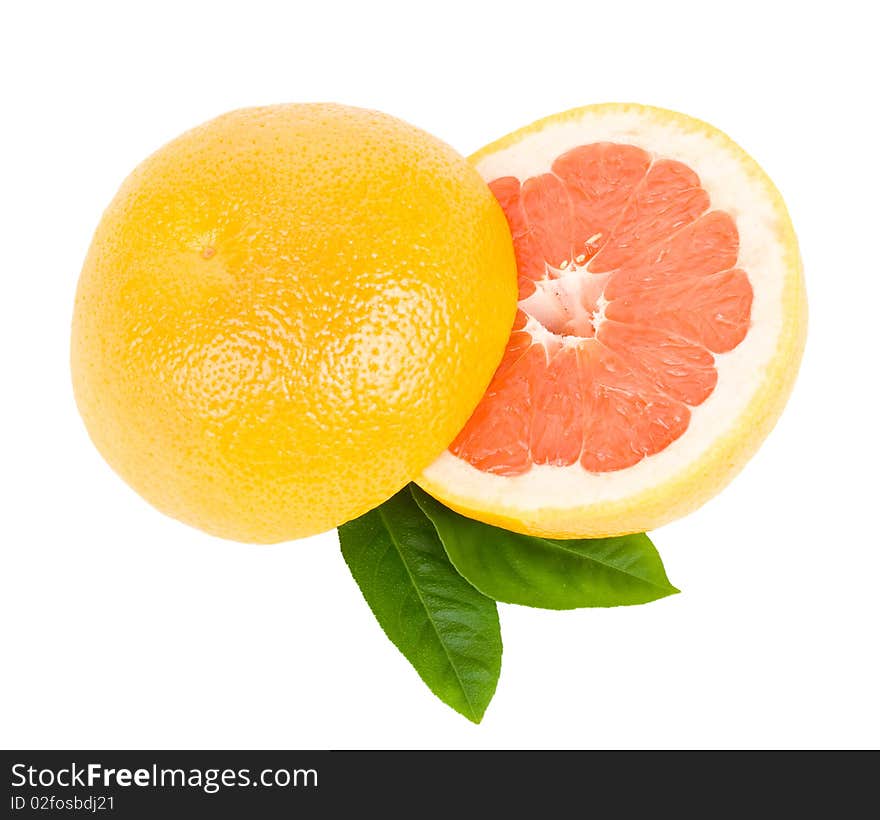 Cut red grapefruit with leaves