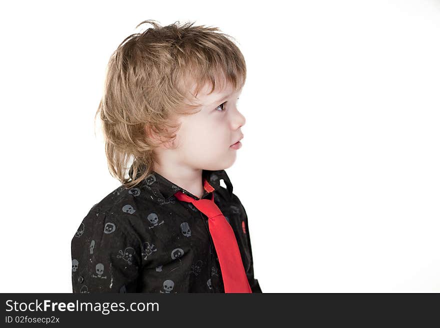 Cute child with red tie looking curious away. Cute child with red tie looking curious away