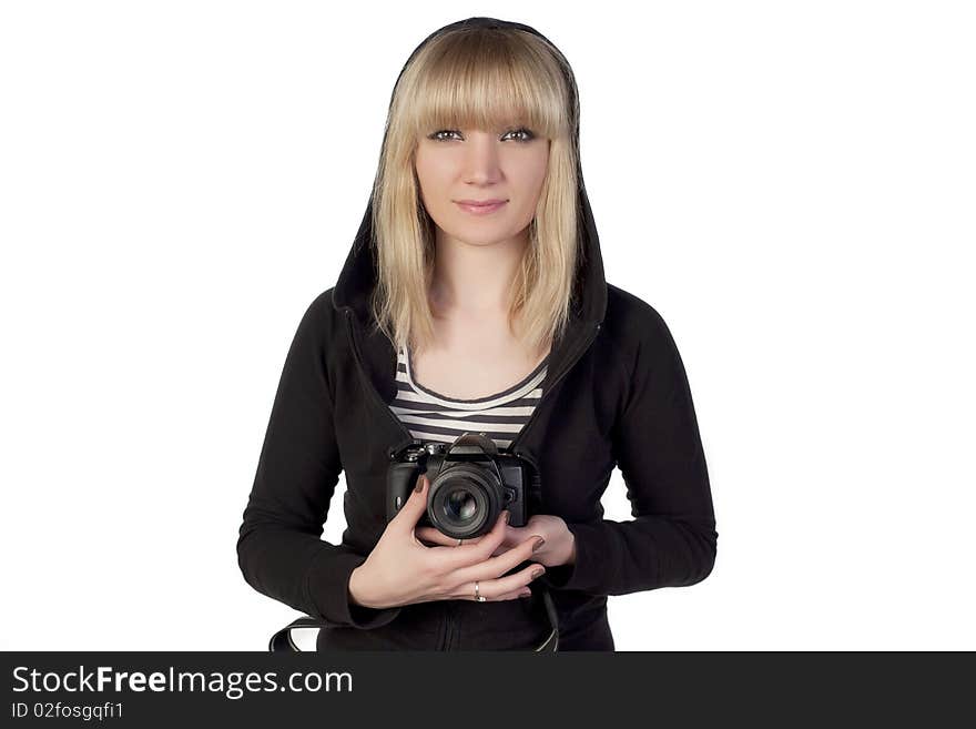 Woman holding camera and looking straight. Woman holding camera and looking straight