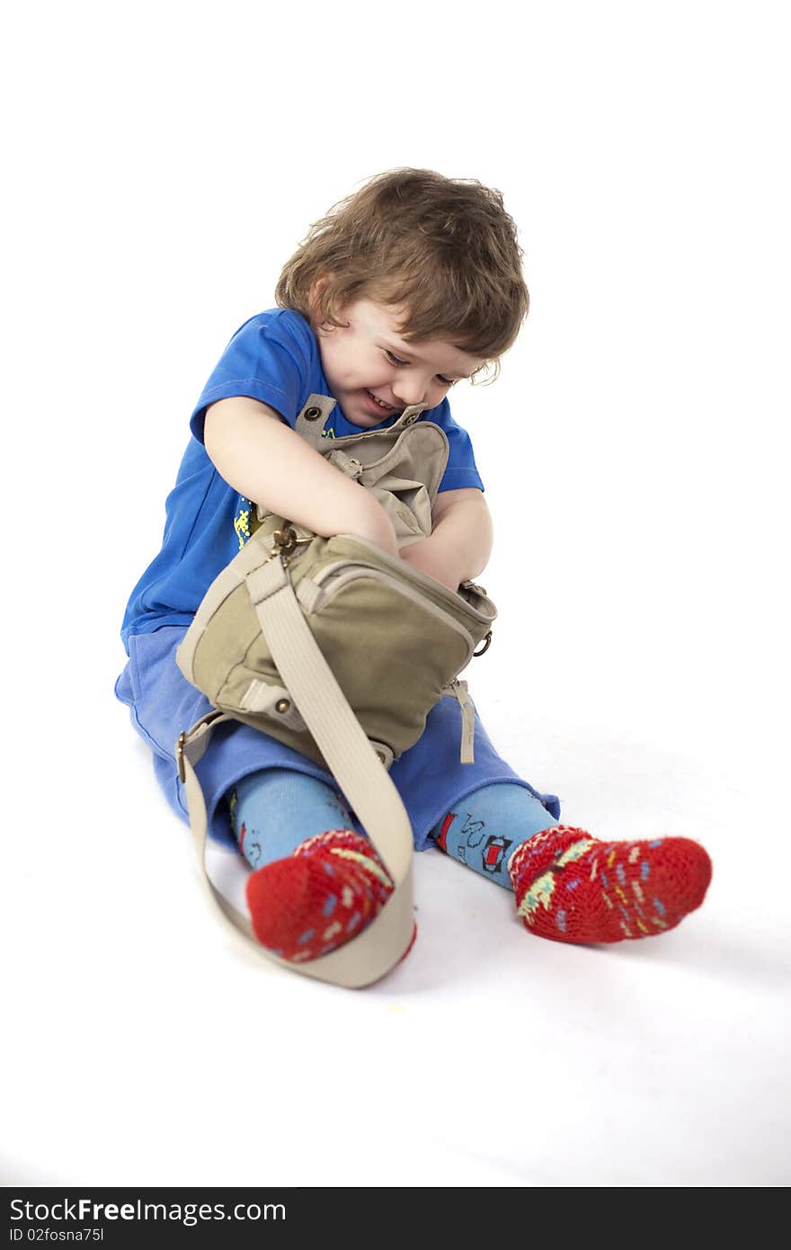 Cute child surprised with a bag. Cute child surprised with a bag