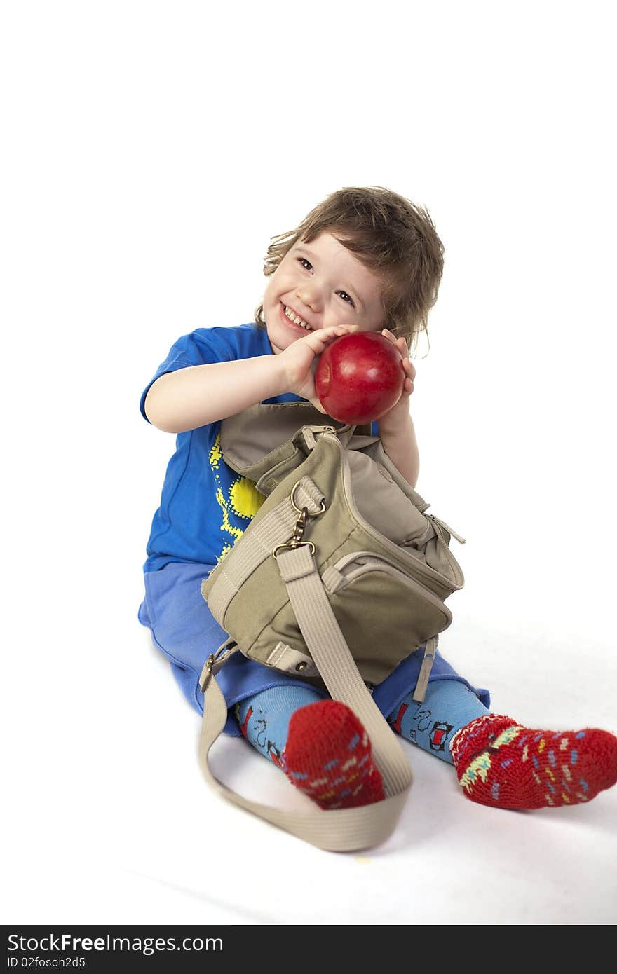 Cute child smiling with an apple. Cute child smiling with an apple