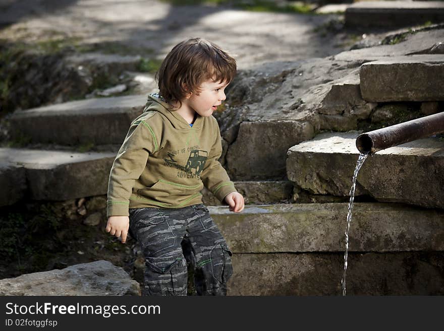 Cute surprised child in a nice landscape. Cute surprised child in a nice landscape