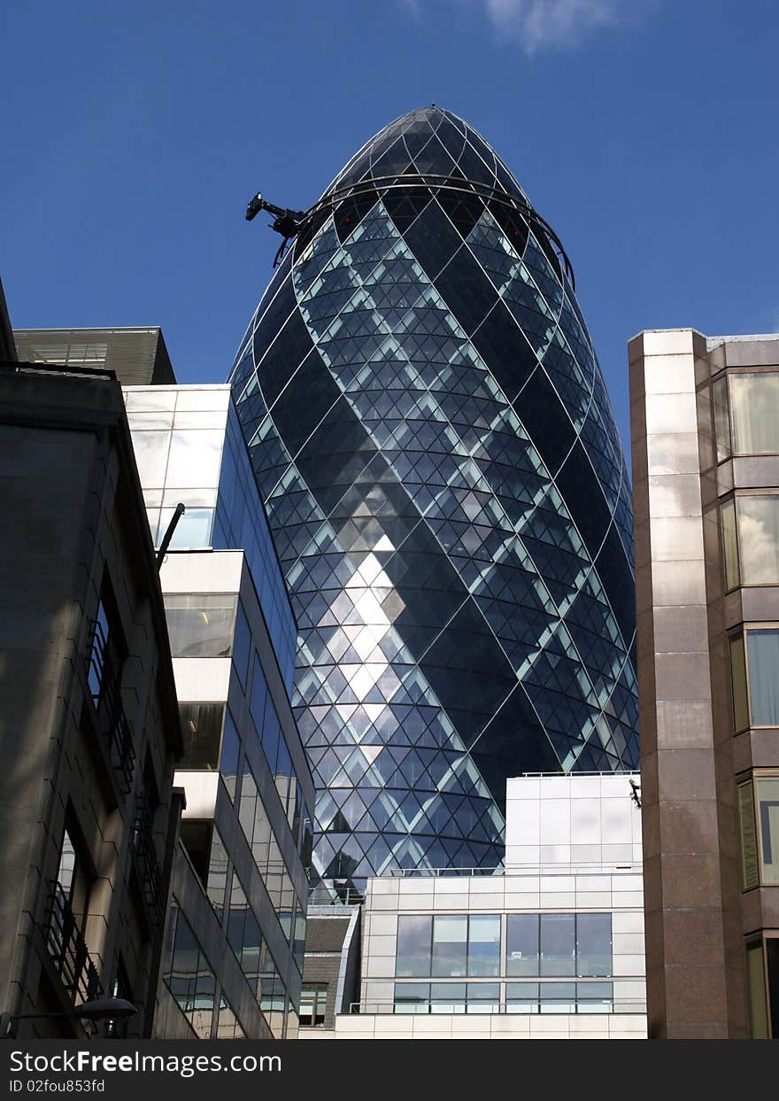 Gherkin building of London with blue sky