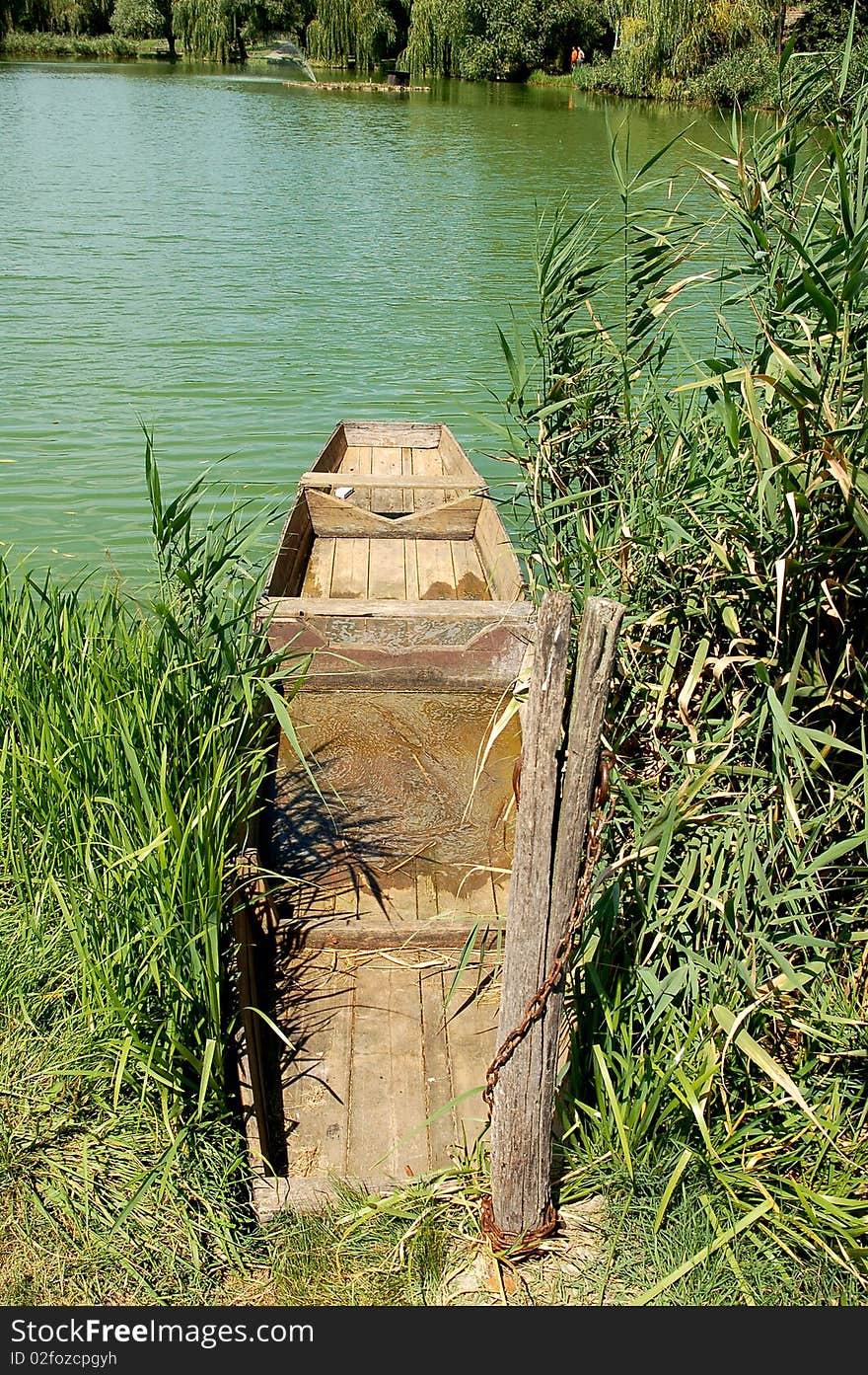 Abandoned rowing boat on a lake. Abandoned rowing boat on a lake.