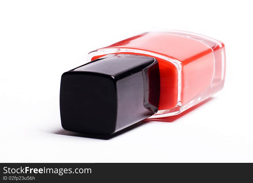 Vertical image of red nail polish isolated on a white background. Vertical image of red nail polish isolated on a white background