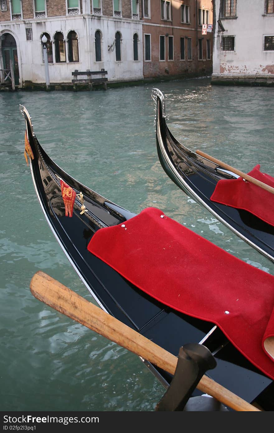 The shining prows of moored gondolas. The shining prows of moored gondolas