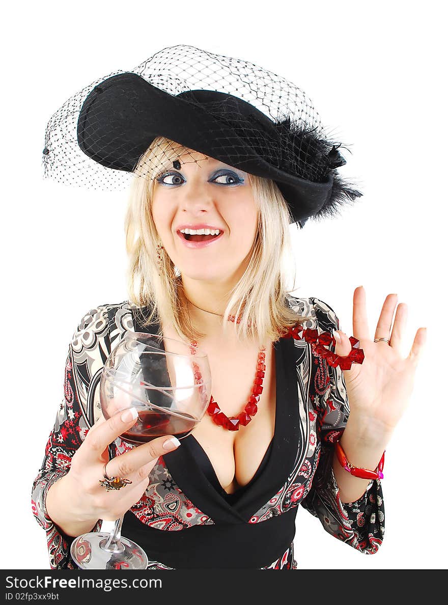 Beautiful blond woman in fashion dress and old stile hat with glass of wine isolated on the white. Studio shoot for actress in retro stile. Beautiful blond woman in fashion dress and old stile hat with glass of wine isolated on the white. Studio shoot for actress in retro stile.