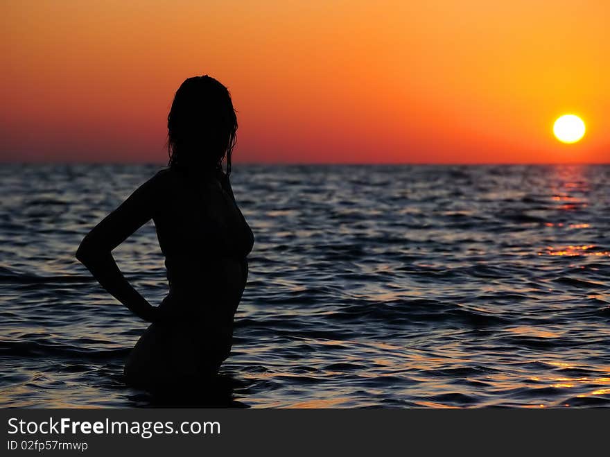 Teen in water. Decline. Silhouette. Teen in water. Decline. Silhouette.