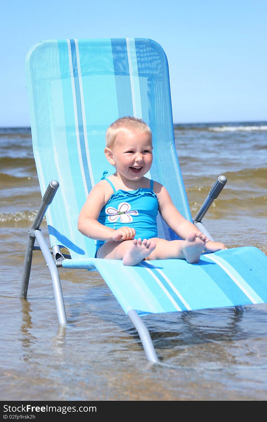 Cute little girl relaxing on beach. Cute little girl relaxing on beach