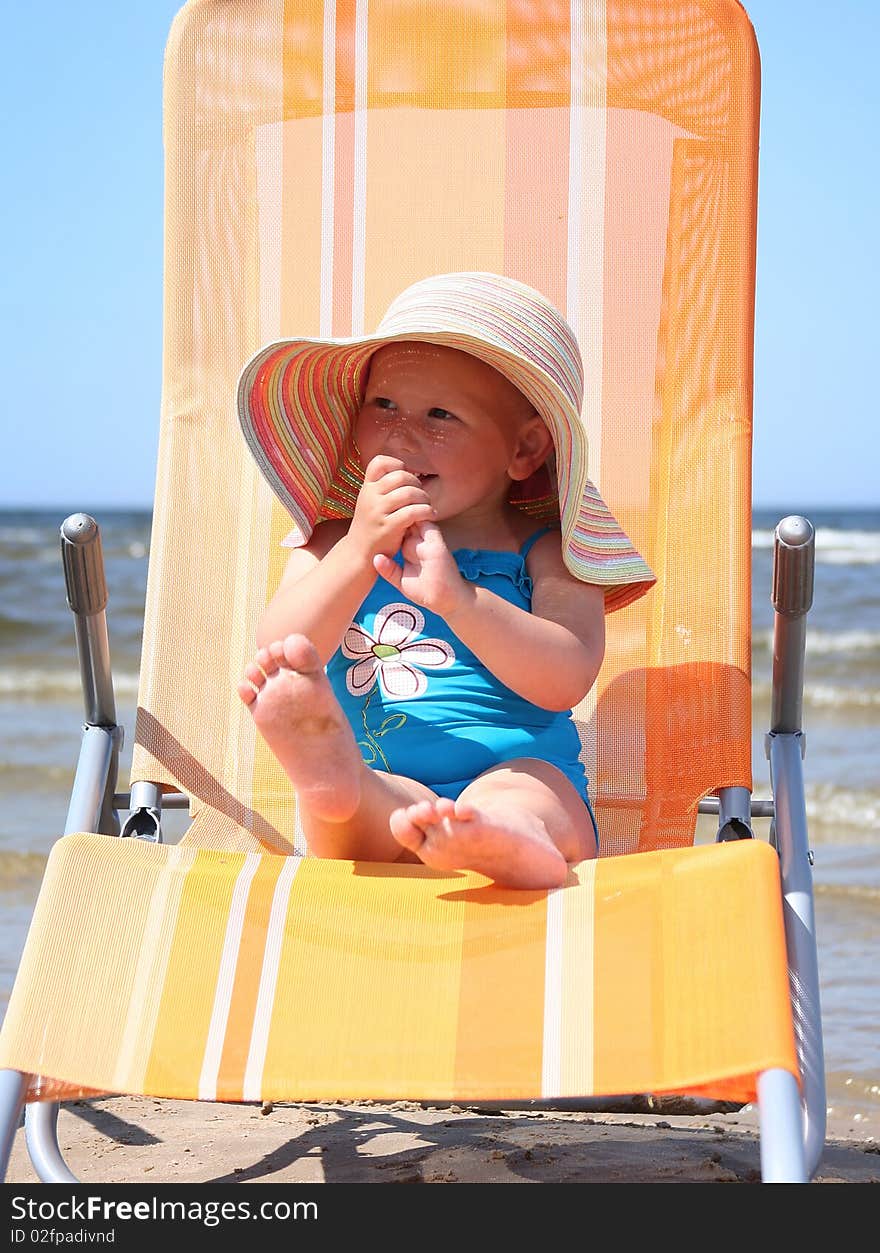 Cute little girl relaxing on beach. Cute little girl relaxing on beach