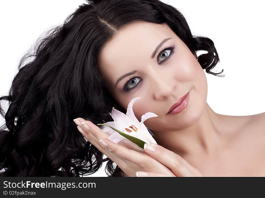 Beautiful woman with a lily flower on a white background. Beautiful woman with a lily flower on a white background