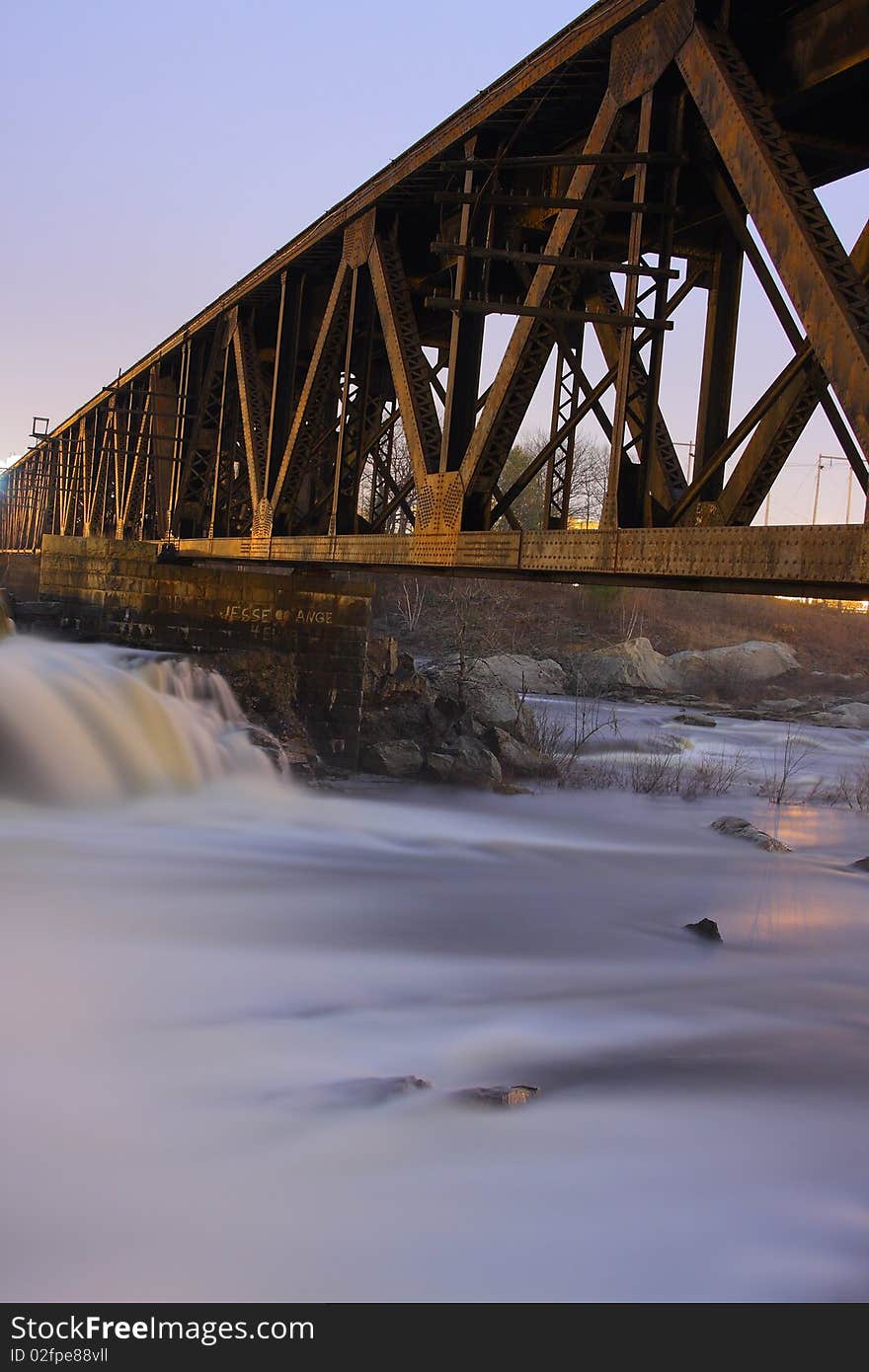 This is a train tressell that spans a local river. The image was taken at night and was intended to show the bridging of industry over barriers. This is a train tressell that spans a local river. The image was taken at night and was intended to show the bridging of industry over barriers.