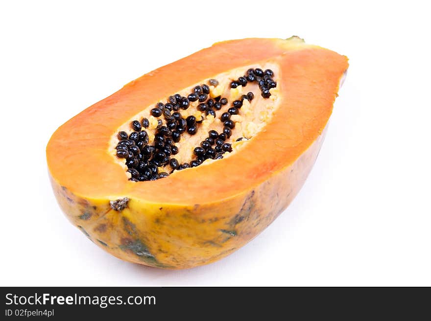 Half of papaya isolated on white