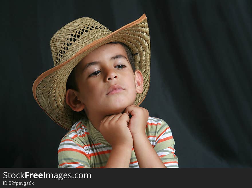 At the beginning of a young boy with cowboy hat image. At the beginning of a young boy with cowboy hat image