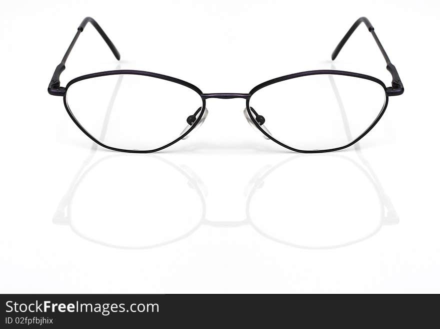 Eyeglasses closeup on a white background with reflection