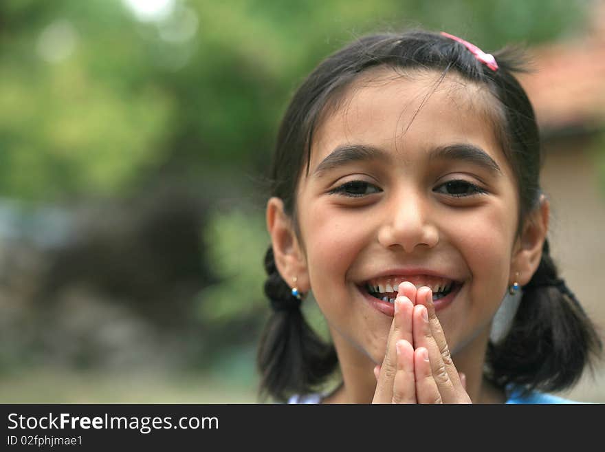 Cute little girl and a beautiful spring. Cute little girl and a beautiful spring